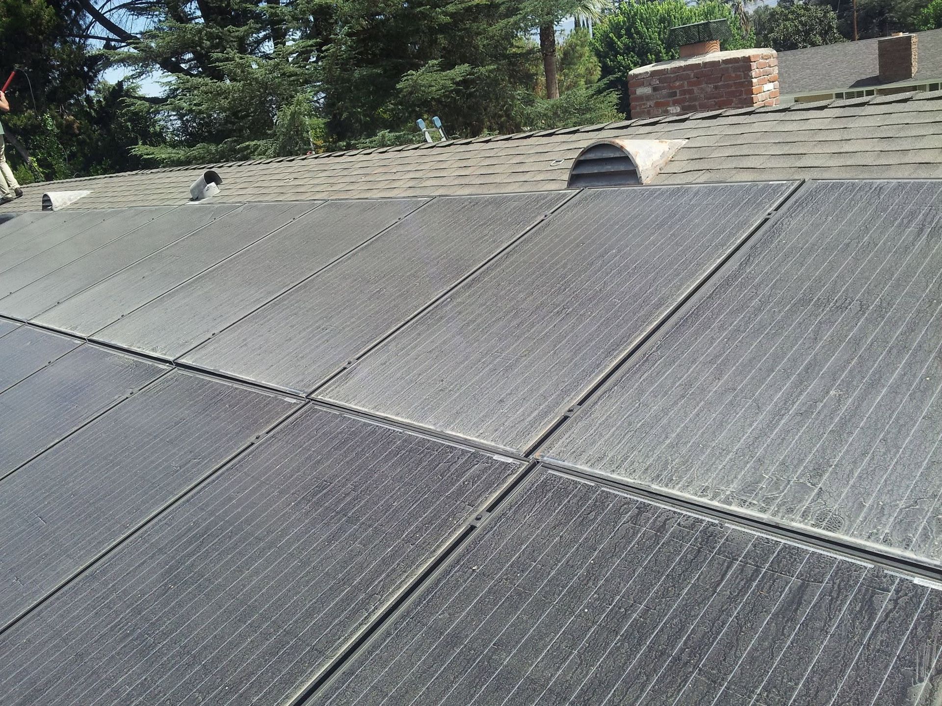 Dust and debris coating rooftop solar panels