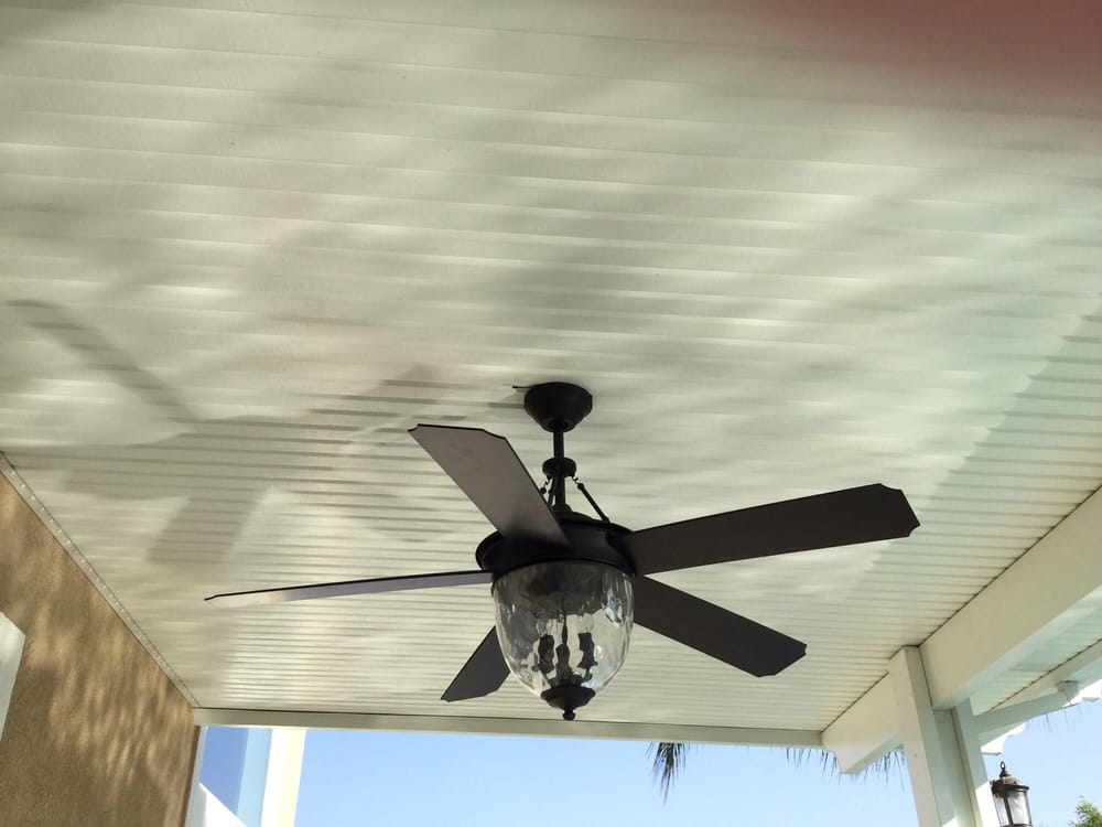 Covered patio ceiling with an outdoor fan