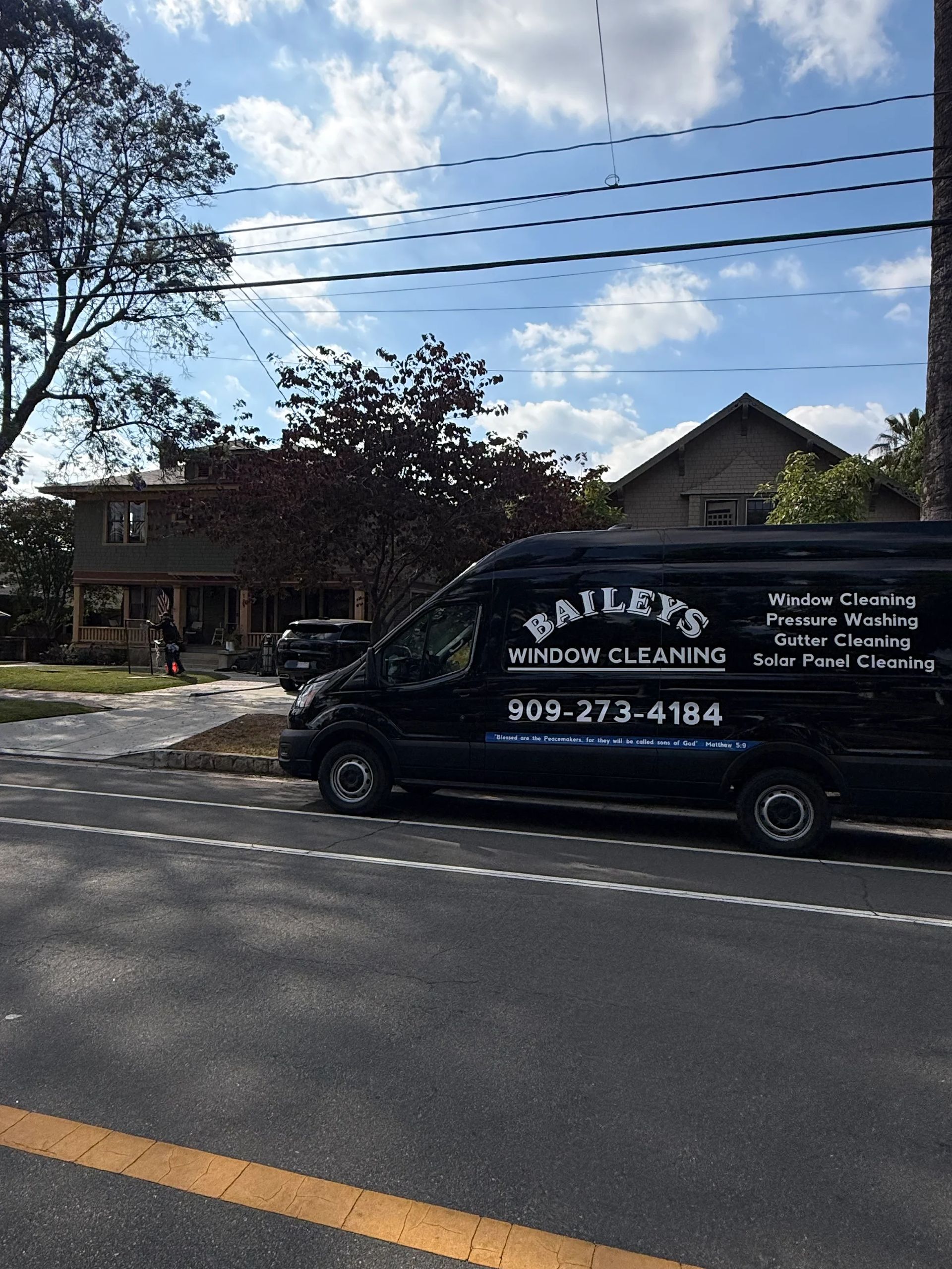Bailey's Window Cleaning work van parked at a customer
property